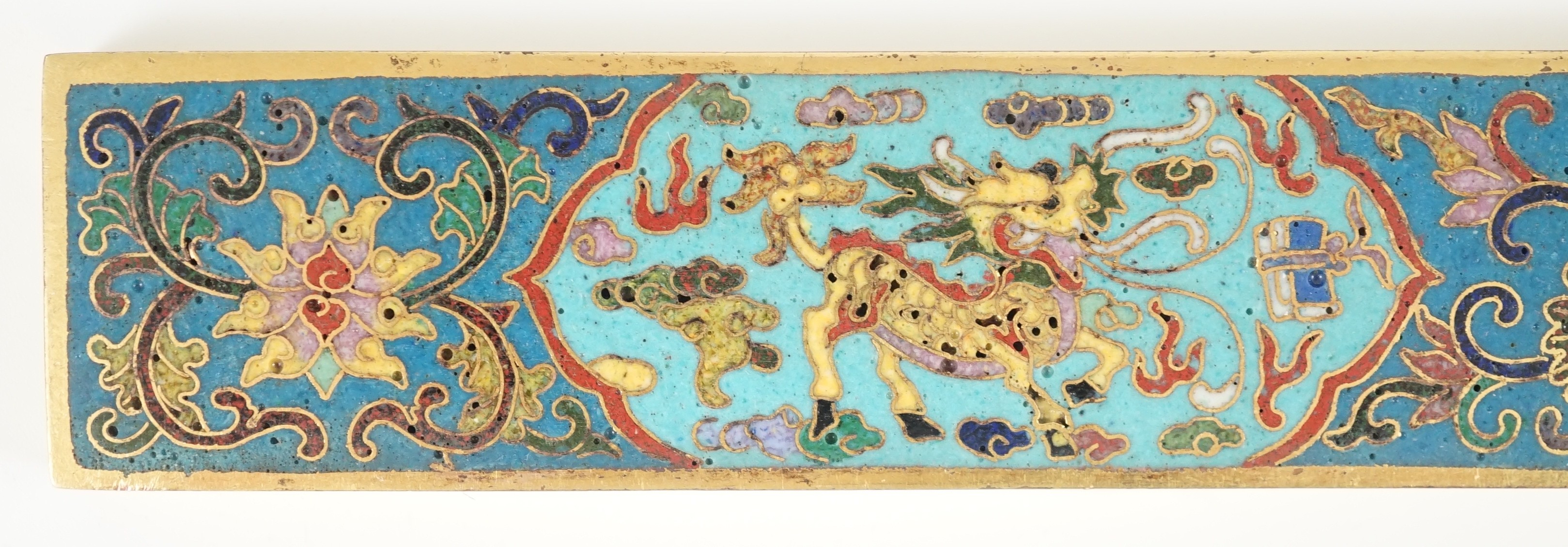 A Chinese cloisonné enamel and gilt bronze scroll weight, 24.8cm long